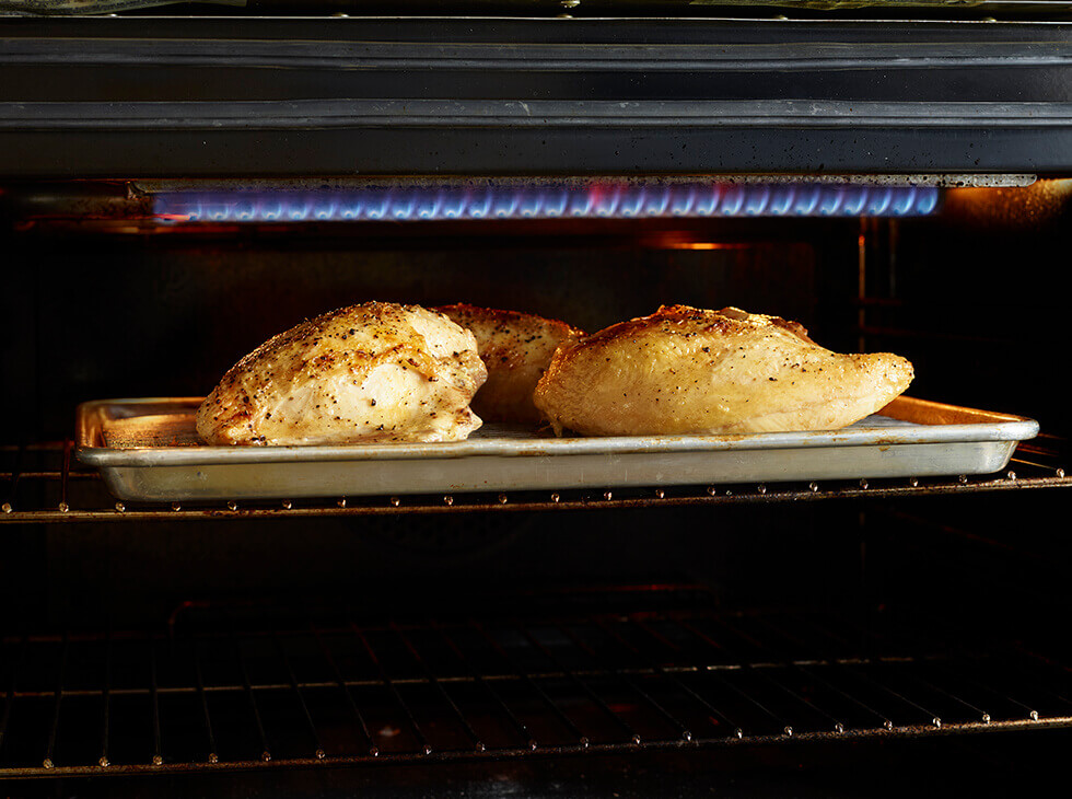 Chicken breast on a pan sheet for broiling