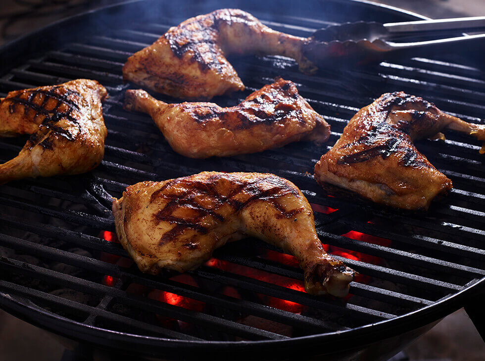 Chicken quarters on the grill 